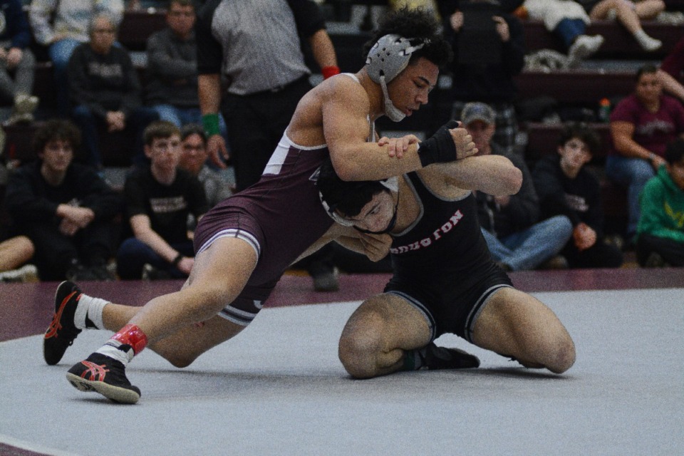 <strong>Damen Pullen of Collierville High faces off against Houston High's Jacob Geiser on Saturday, Feb. 11, 2023, at Collierville High in the 132-pound division at the Region Championship.</strong>&nbsp;<strong>Pullen picked up the win and his third region title.</strong>&nbsp;(Joshua White/Special to The Daily Memphian)