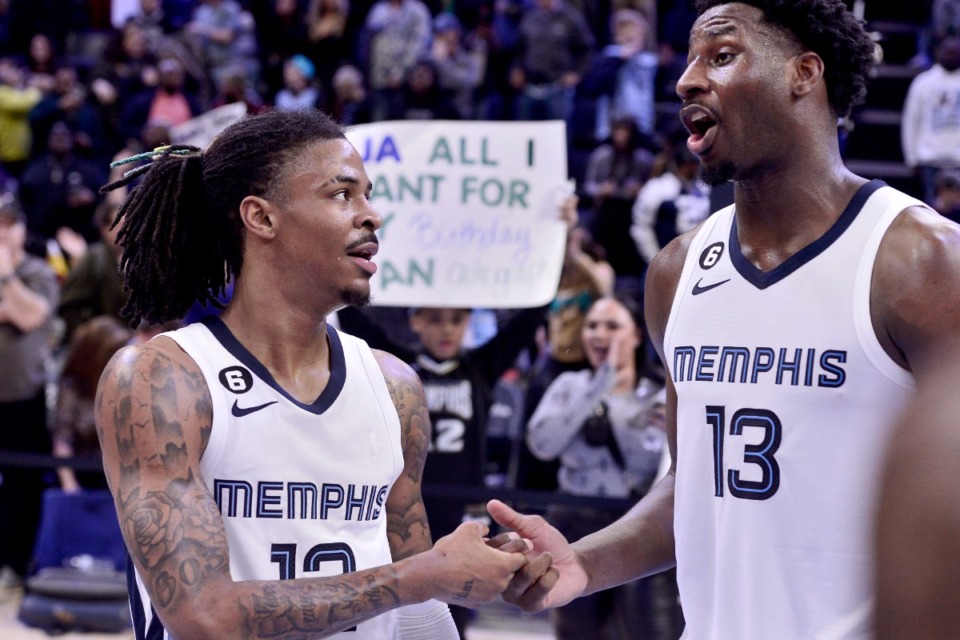 <strong>Memphis Grizzlies guard Ja Morant, left, and forward Jaren Jackson Jr. (13) greet each other after a victory against the Indiana Pacers in an NBA basketball game Sunday, Jan. 29, 2023, in Memphis, Tenn.</strong> (AP Photo/Brandon Dill)