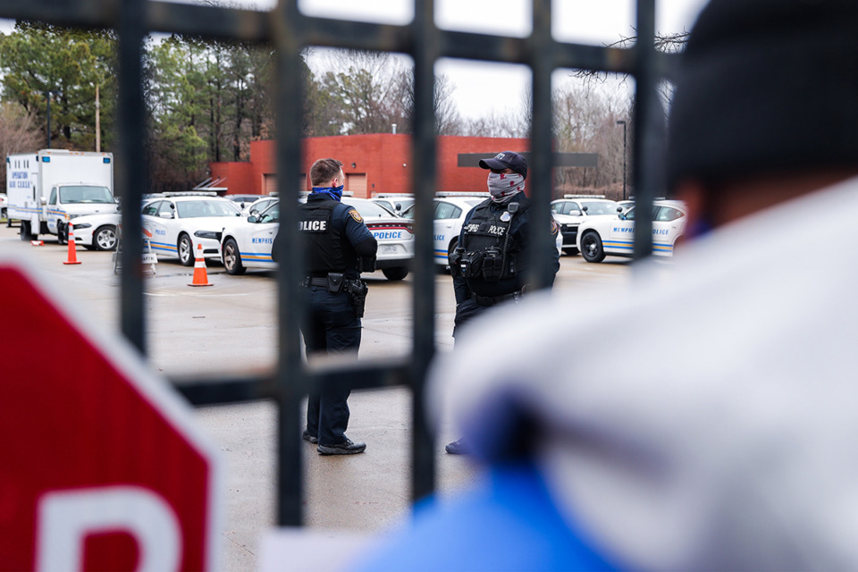 <strong>Memphis police officers wait behind a locked gate during a protest at the Ridgeway police station Jan. 29.</strong> (Patrick Lantrip/The Daily Memphian)