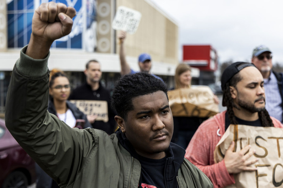 <strong>Ron Davis, an organizer with MICAH, holds his fist in the air during three minutes of silence at the &ldquo;Students and Teachers for Tyre&rdquo; protest at the intersection of Poplar Avenue and South Highland Street on Feb. 16.</strong> (Brad Vest/Special to The Daily Memphian)