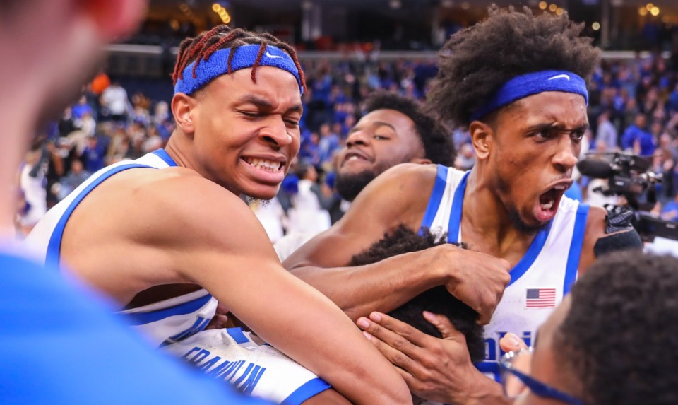 <strong>Memphis forward DeAndre Williams (12) hugs teammate Damaria Franklin (55) after the game-winning shot against UCF on Feb. 12, 2023.</strong> (Patrick Lantrip/The Daily Memphian)