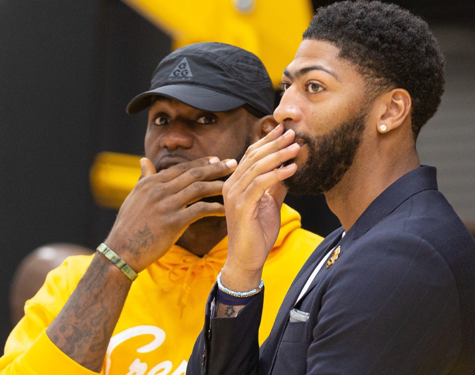 <strong>Los Angeles Lakers NBA basketball players, LeBron James, left, and Anthony Davis share a moment after David was introduced at a news conference at the UCLA Health Training Center in El Segundo, California, Saturday, July 13, 2019</strong>. (AP Photo/Damian Dovarganes)