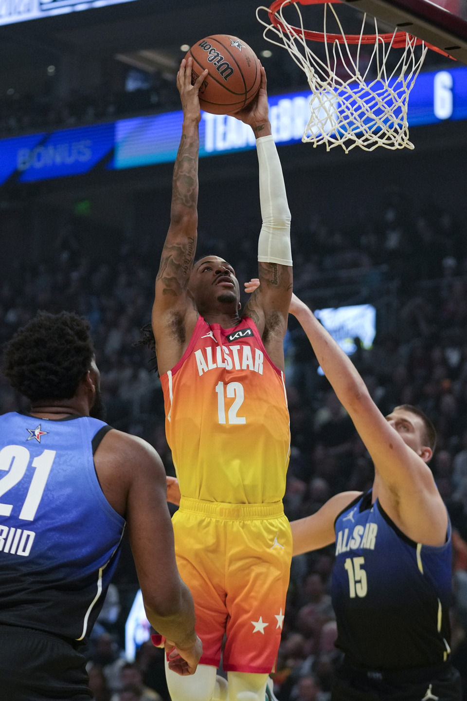 <strong>Team Giannis guard Ja Morant (12) shoots during the first half of the NBA basketball All-Star game Sunday, Feb. 19, 2023, in Salt Lake City.</strong> (Rick Bowmer/AP Photo)