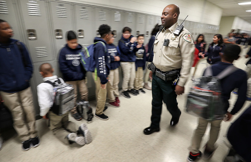 <strong>Deputy Chris Stephens, the resource officer at Kate Bond Middle School, walks the halls between classes encouraging kids to move along on March 1, 2019.</strong> (Jim Weber/The Daily Memphian file)