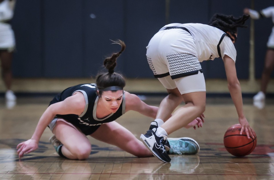 <strong>Whitehaven's Layla Hampton (4) steals the ball from Houston's Mckenzie Percoski (31) during the Feb. 24, 2023, game.</strong> (Patrick Lantrip/The Daily Memphian)