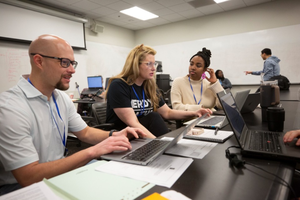 <strong>(Left to right) Jason Pugh, Jan Richards and Morgan Gray work on a Memphis Public Interest Law Center automation project during GiveCamp Memphis&rsquo; annual three-day tech event at the University of Memphis campus on Feb. 25.</strong> (Ziggy Mack/Special to The Daily Memphian)