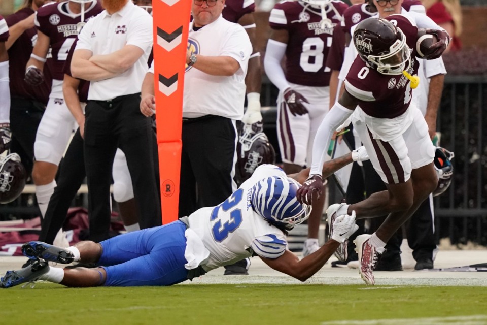 <strong>Memphis defensive back Ladarian Paulk (23) trips up Mississippi State wide receiver Rara Thomas (0) during the first half of an NCAA college football game in Starkville, Miss., Saturday, Sept. 3, 2022.</strong> (Rogelio V. Solis/AP file)