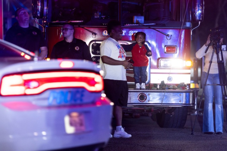 <strong>A child beams with delight on the front of a fire truck in the &ldquo;Sea of Blue&rdquo; event on Feb. 27, 2023.</strong>&nbsp;(Brad Vest/Special to The Daily Memphian