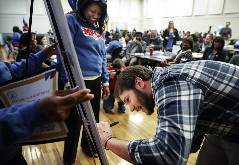 <strong>University of Memphis student Cody Cameron signs a ceremonial teacher contract with Memphis-Shelby County Schools during the inaugural&nbsp;New Teacher Signing Day ceremony on Wednesday, March 1, 2023.</strong> (Mark Weber/The Daily Memphian)