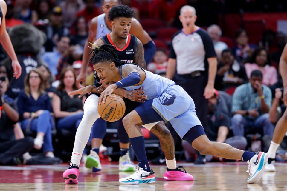 <strong>Memphis Grizzlies guard Ja Morant, front, drives around Houston Rockets guard Jalen Green, back, on March 1, 2023, in Houston.</strong> (Michael Wyke/AP)