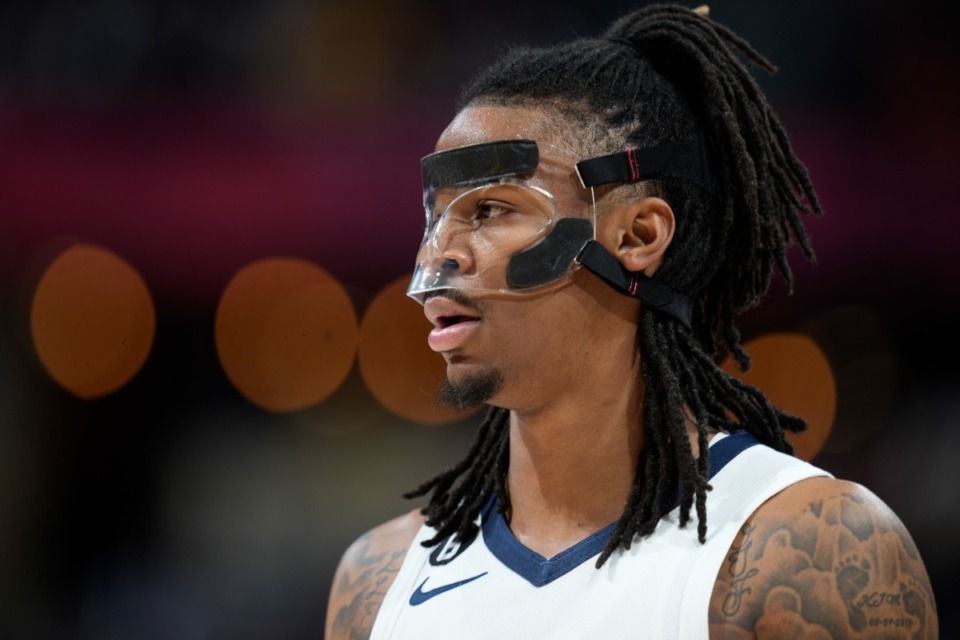 <strong>Memphis Grizzlies guard Ja Morant wears a protective mask in the game against the Denver Nuggets on Friday, March 3, 2023, in Denver.</strong> (David Zalubowski/AP)