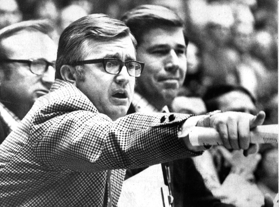 <strong>In this 1972 photo, Memphis State basketball coach Gene Bartow, left, sits next to assistant coach Wayne Yates during a college basketball game in Memphis. Bartow succeeded John Wooden at UCLA and later began UAB's athletic program.</strong> (The Commercial Appeal/AP Photo file)