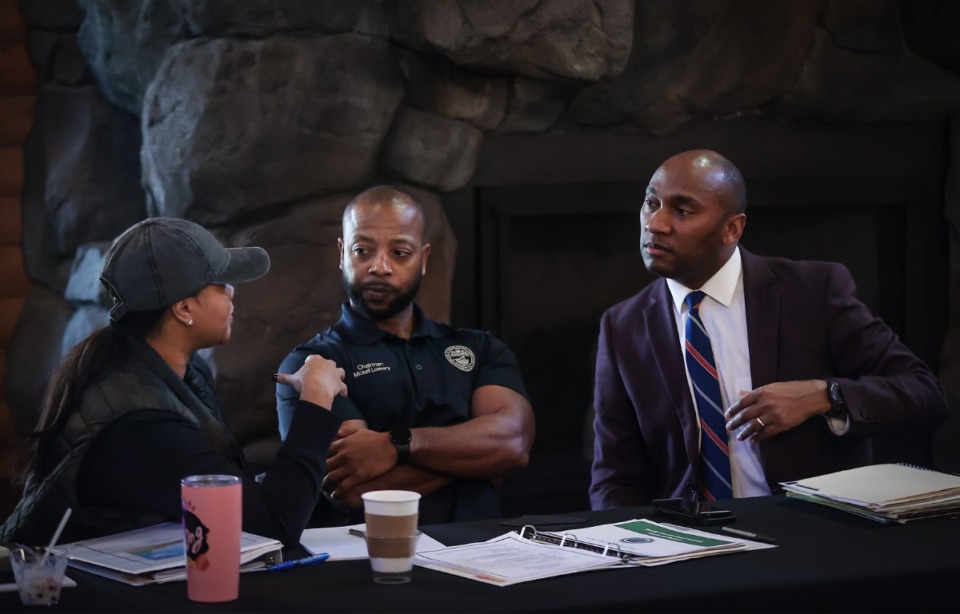 <strong>Shelby County Mayor Lee Harris (right) talks with commissioners Mickell Lowery (center) and Miska Clay Bibbs after a budget retreat Saturday, March 4, 2023, at the Memphis Zoo.</strong> (Patrick Lantrip/The Daily Memphian)