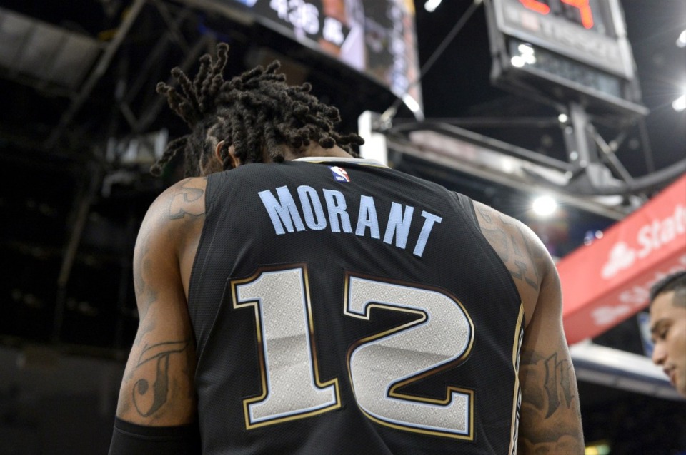 <strong>Memphis Grizzlies guard Ja Morant (12) issued an apology Saturday amid an NBA investigation of a social media post in which he&rsquo;s seen flashing a gun at a club.</strong>&nbsp;(Brandon Dill/AP file)
