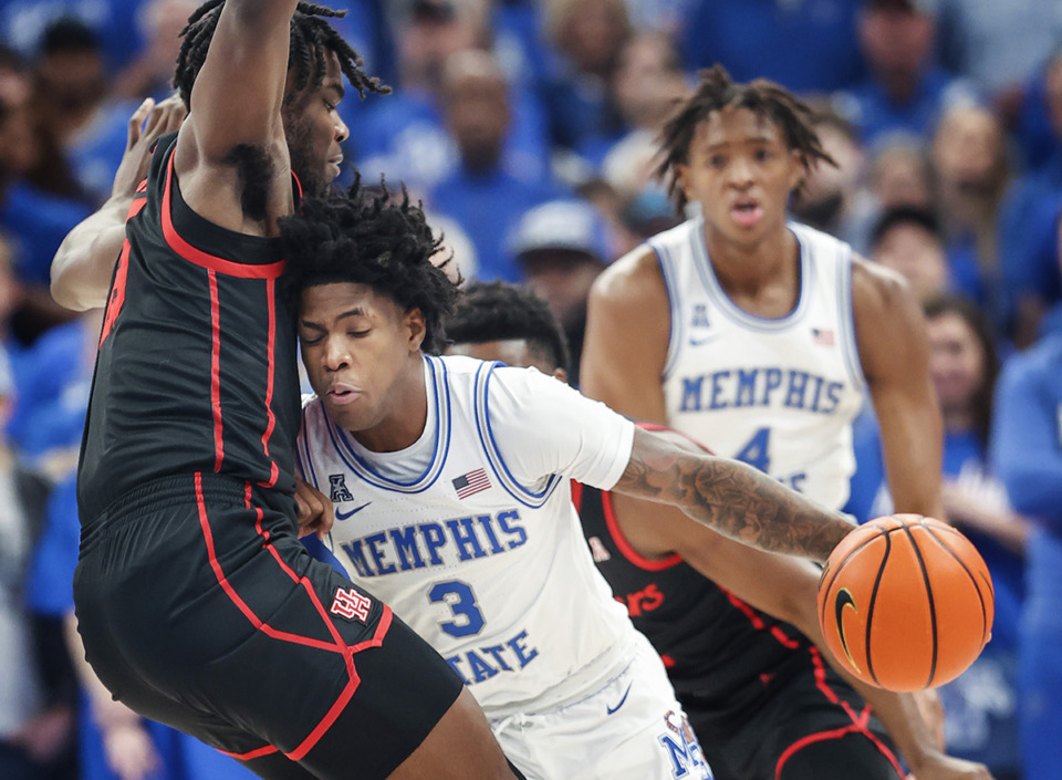 <strong>Memphis Tigers guard Kendric Davis (right) runs into Houston defender Jarace Walker (left) during action on March 5.</strong> (Mark Weber/The Daily Memphian)