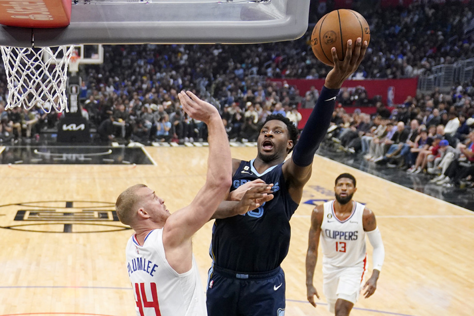 <strong>Memphis Grizzlies forward Jaren Jackson Jr. (center) shoots as Los Angeles Clippers center Mason Plumlee (left) and forward Paul George defend during the game Sunday, March 5, 2023, in Los Angeles.</strong> (Mark J. Terrill/AP Photo)