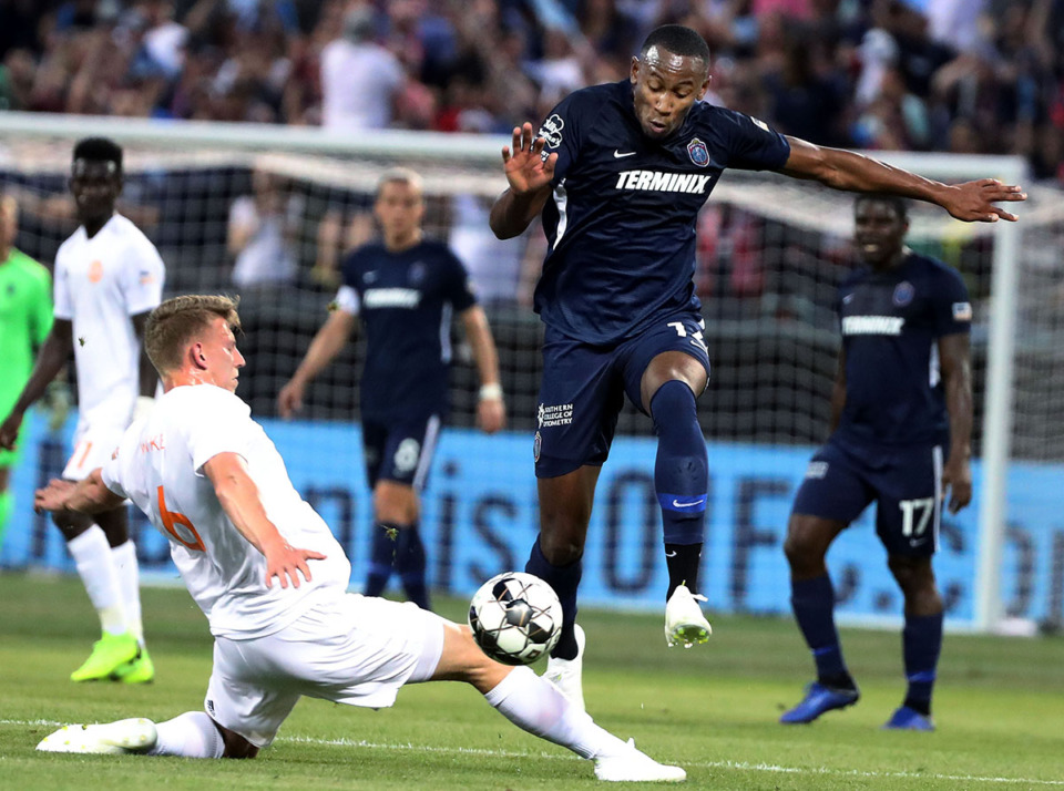 <strong>Memphis 901 FC has re-signed forward Rashawn Dally for 2023. He was a member of the USL Championship-member 901 FC&rsquo;s inaugural season in 2019 and also played for Memphis in 2021. Here Dally (14) hurdles over Atlanta United 2 midfielder Laurence Wyke (6) during a match against Atlanta United 2 on Wednesday, April 10, 2019.</strong> (Houston Cofield/The Daily Memphian file)