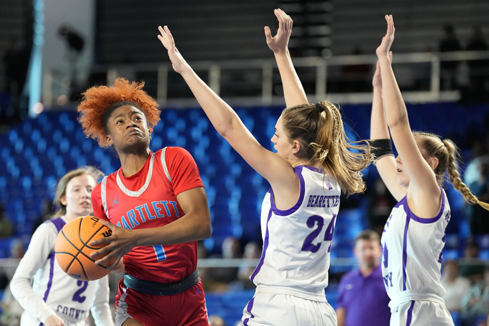<strong>Barlett&rsquo;s Carrington Jones (1) drives against Sevier County&rsquo;s Hailey Williams (24) during the first half of a Class 4A game in the TSSAA BlueCross girls&rsquo; state basketball tournament March 7 in Murfreesboro, Tenn.</strong> (Mark Humphrey/Special to The Daily Memphian)