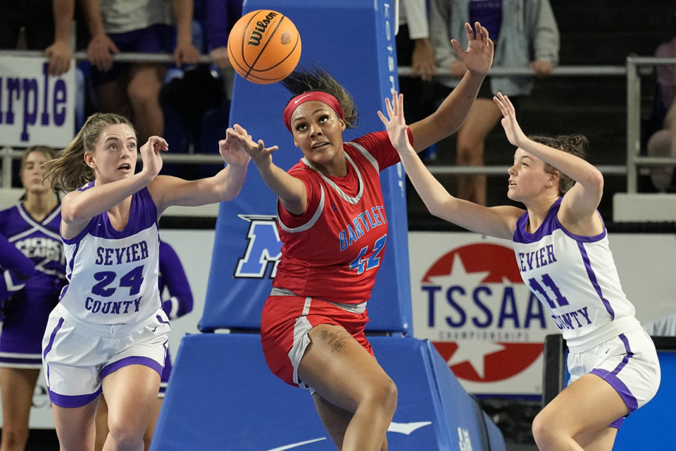 <strong>Bartlett&rsquo;s Mallory Collier (42) reaches for a rebound with Sevier County&rsquo;s Hailey Williams (24) and Emma Fowler (11) during the second half of a Class 4A game in the TSSAA BlueCross girls&rsquo; state basketball tournament March 7 in Murfreesboro, Tenn.</strong> (Mark Humphrey/Special to The Daily Memphian)