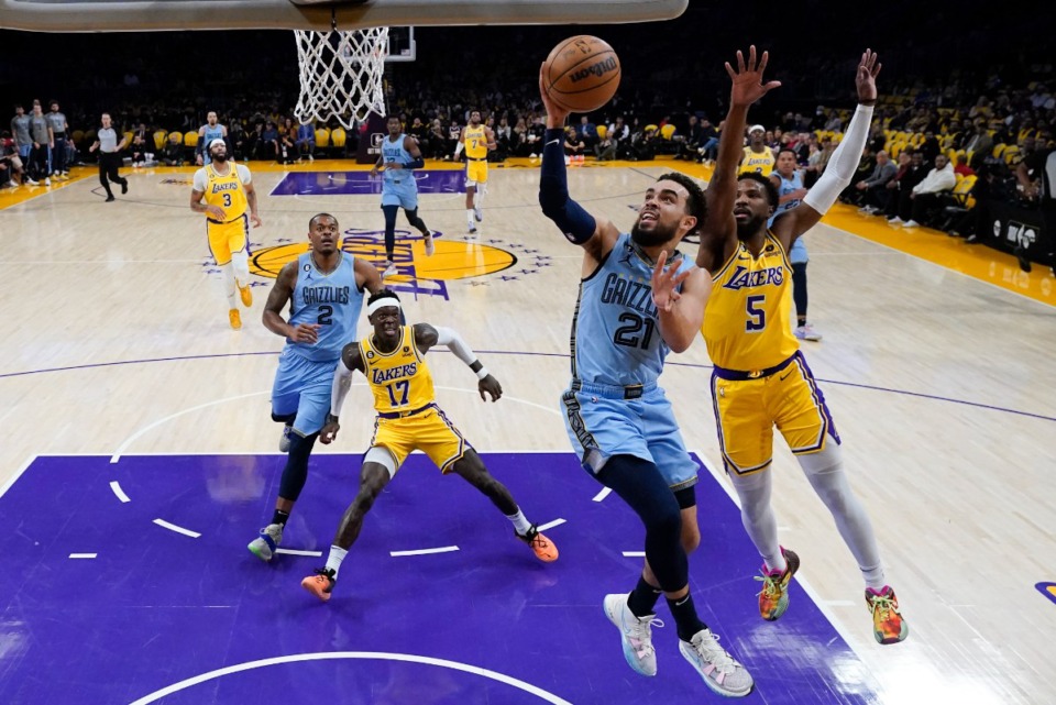 <strong>Memphis Grizzlies point guard Tyus Jones (21) puts a shot past Los Angeles Lakers' Malik Beasley (5) don March 7, 2023, in Los Angeles.</strong> (Jae C. Hong/AP)