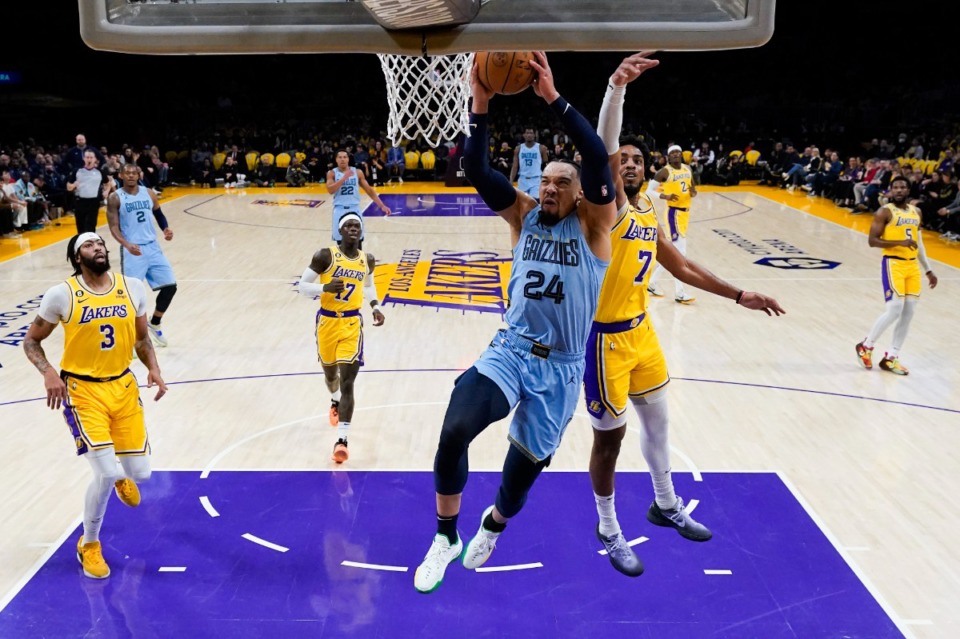 <strong>Memphis Grizzlies guard Dillon Brooks (24) goes for a basket despite defense by Los Angeles Lakers' Troy Brown Jr. (7) on March 7, 2023, in Los Angeles.</strong> (Jae C. Hong/AP)