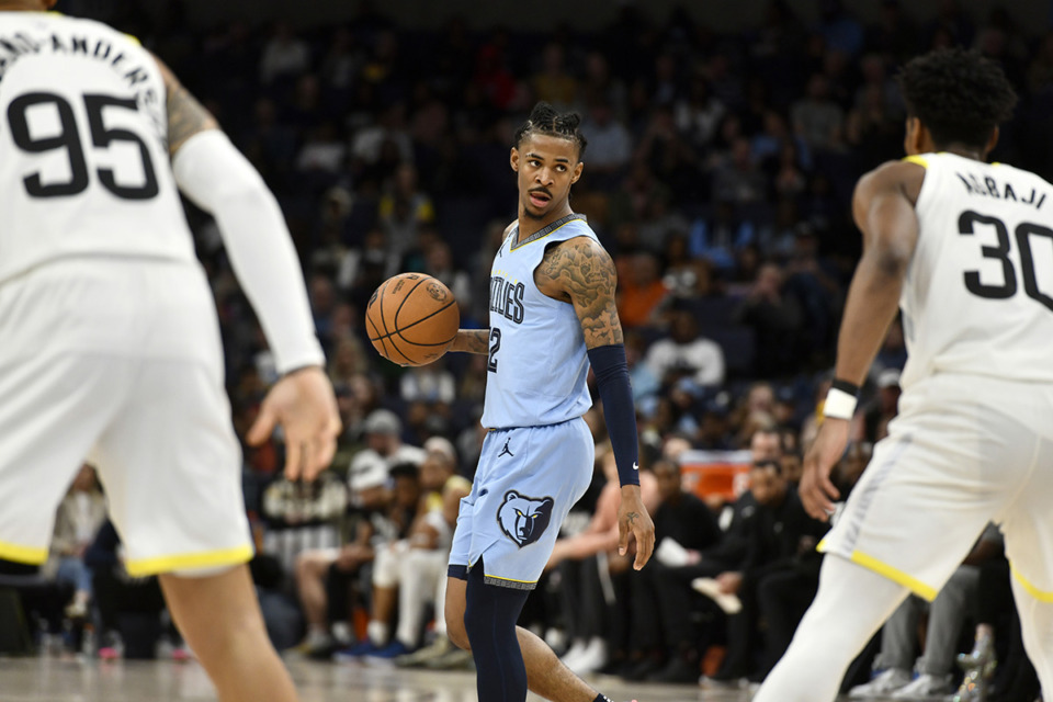 <strong>Memphis Grizzlies guard Ja Morant (12) plays in the second half of an NBA basketball game against the Utah Jazz on Feb. 15 in Memphis.</strong> (Brandon Dill/AP Photo)