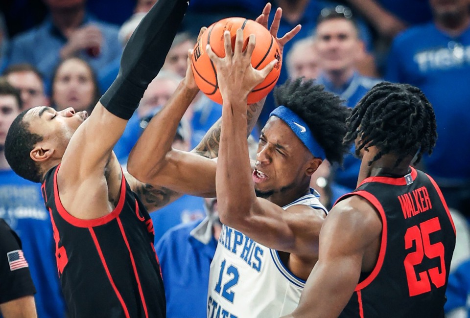 <strong>Memphis Tigers forward DeAndre Williams (middle) battles Houston on March 5, 2023. It&rsquo;s likely the Tigers will see the Mustangs again in the AAC Tournament.</strong> (Mark Weber/The Daily Memphian file)