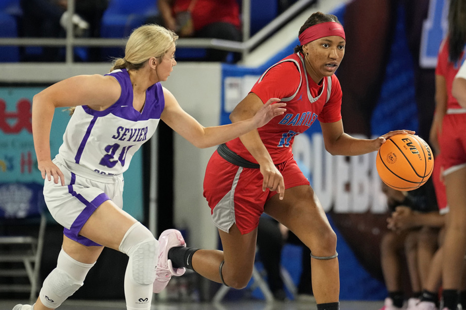 <strong>Bartlett&rsquo;s Raven Sims (11) is defended by Sevier County&rsquo;s Kinley Loveday (20) during the first half of a Class 4A game in the TSSAA BlueCross girls&rsquo; state basketball tournament Tuesday, March 7, 2023, in Murfreesboro, Tenn.</strong> (Mark Humphrey/Special to The Daily Memphian)