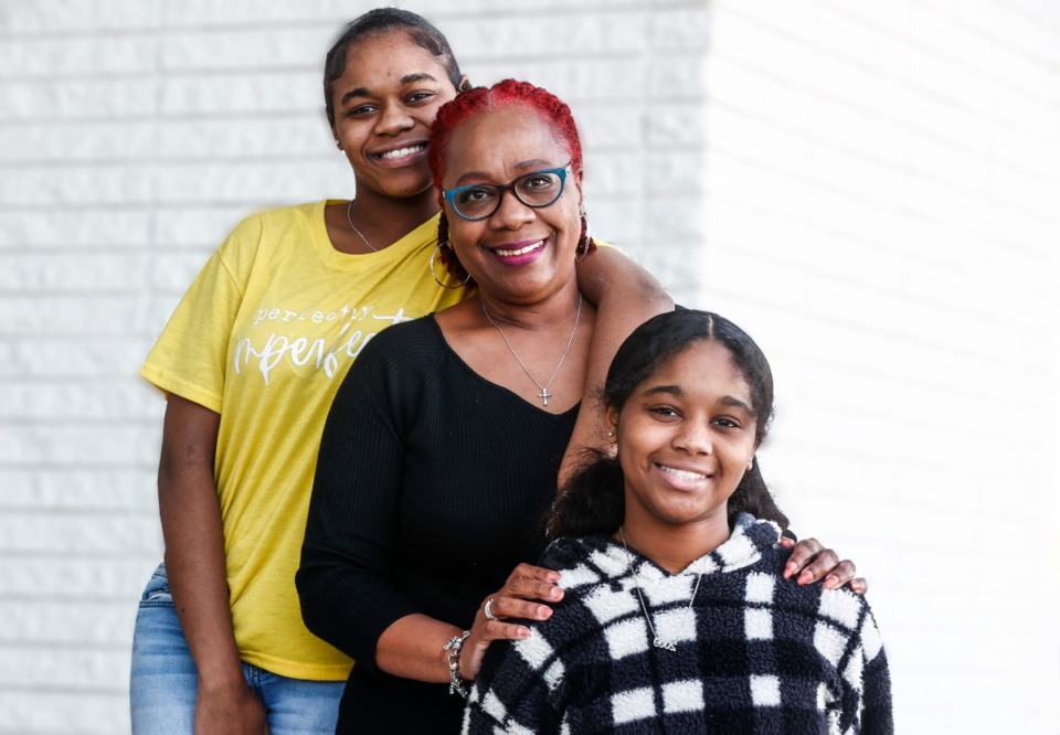 <strong>Lenora Jones (middle) with her adopted granddaughters Jamyia Edwards, 15, (left) and Jaliah Edwards, 13 (right) on Tuesday, March 7, 2023.</strong> (Mark Weber/The Daily Memphian)