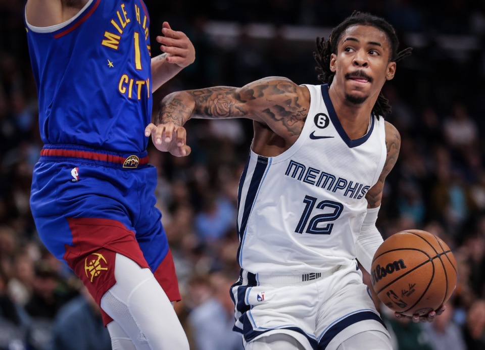 <strong>Grizzlies guard Ja Morant (12) drives to the basket during a Feb. 25, 2023 game against the Denver Nuggets. Morant will be&nbsp;&lsquo;away from the team&rdquo; for the nexr few games.&nbsp;</strong>(Patrick Lantrip/The Daily Memphian file)