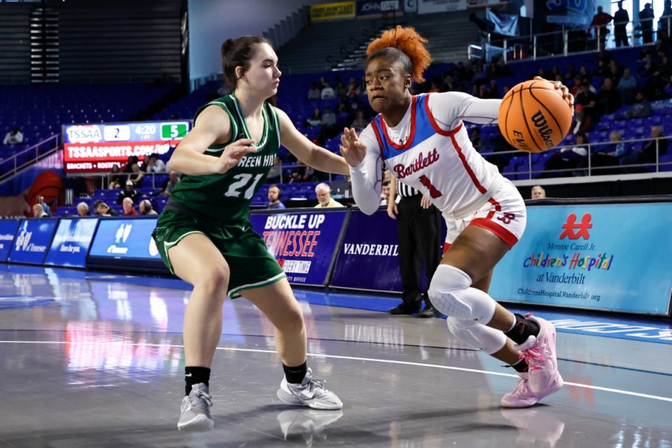 <strong>Bartlett&rsquo;s Carrington Jones (1) drives past Green Hill&rsquo;s Alyssa Porter (21) during a TSSAA Class 4A girls&nbsp;basketball tournament game, Friday, March 10, 2023, in Murfreesboro, TN.</strong> (Wade Payne/Special to The Daily Memphian)
