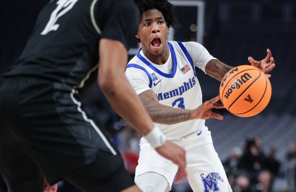 <strong>Memphis guard Kendric Davis (3) passes the ball on March 10, 2023, in the game game against UCF.</strong> (Patrick Lantrip/The Daily Memphian)