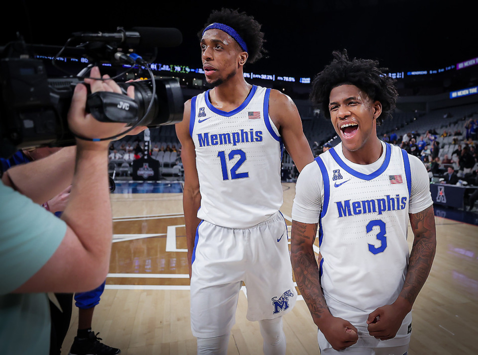 <strong>Memphis guard Kendric Davis (3) and forward Deandre Williams (12) celebrate a win after a March 10, 2023 game against UCF.</strong> (Patrick Lantrip/The Daily Memphian)
