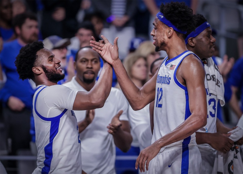 <strong>University of Memphis teammates Alex Lomax (2) and Deandre Williams celebrate in the closing minutes of a blowout win over Tulane March 11, 2023.</strong> (Patrick Lantrip/The Daily Memphian)