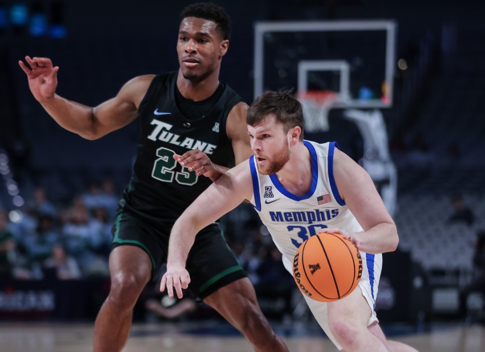 <strong>University of Memphis guard Conor Glennon (30) drives with the basketball during a March 11, 2023 game against Tulane.</strong> (Patrick Lantrip/The Daily Memphian)