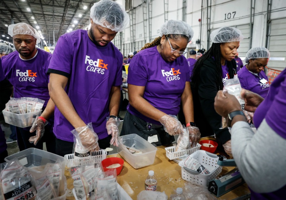 <strong>FedEx team members volunteer to package more than 30,000 meals for people affected by food insecurity around the world Jan. 16.</strong> (Mark Weber/The Daily Memphian file)