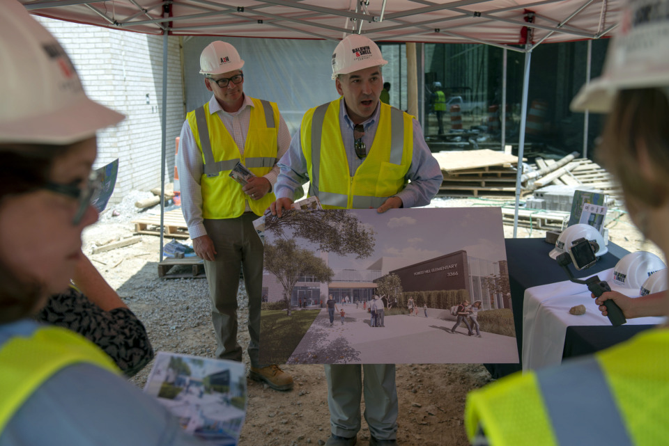 <strong>Germantown Municipal School District Superintendent Jason Manuel (center right) and A2H architect Stewart Smith (center left) lead a tour at the construction site of Forest Hill Elementary School May 8, 2019, in Germantown.</strong> (Brandon Dill/Special To The Daily Memphian)