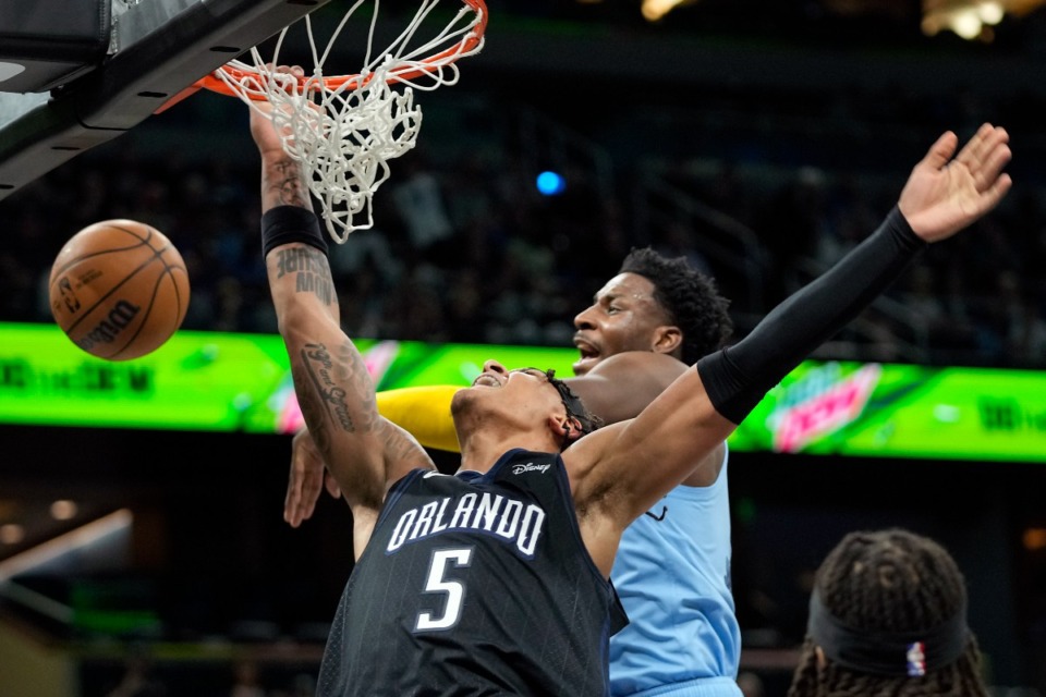 <strong>Memphis Grizzlies' Jaren Jackson Jr. (right) has earned the nickname B10ck Panth3r with blocks like this against Orlando Magic's Paolo Banchero (5) on&nbsp; Jan. 5, 2023, in Orlando, Florida.</strong> (John Raoux/AP file)
