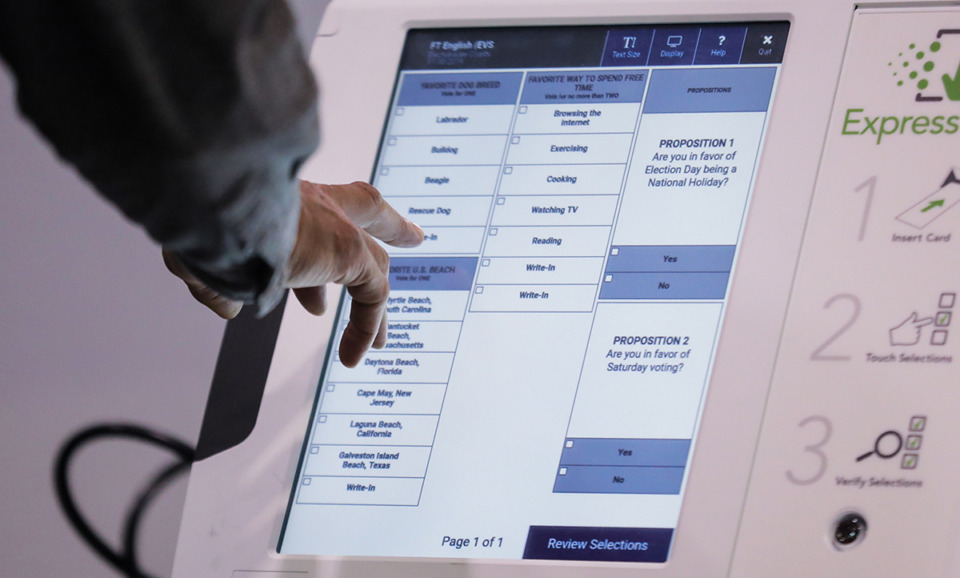 <strong>Shelby County residents work a sample ballot on the new voting machines at the Benjamin L. Hooks Central Library Oct. 6, 2022.</strong> (Patrick Lantrip/The Daily Memphian file)