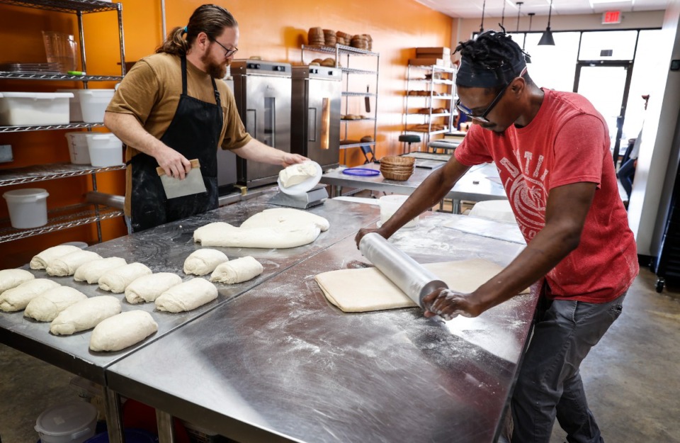 <strong>Dan Beach (left) and Josh Lawrence (right) prepare bread and croissant dough for baking on March 10 at Wild Cultures Sourdough Bakery in Hernando.</strong> (Mark Weber/The Daily Memphian)