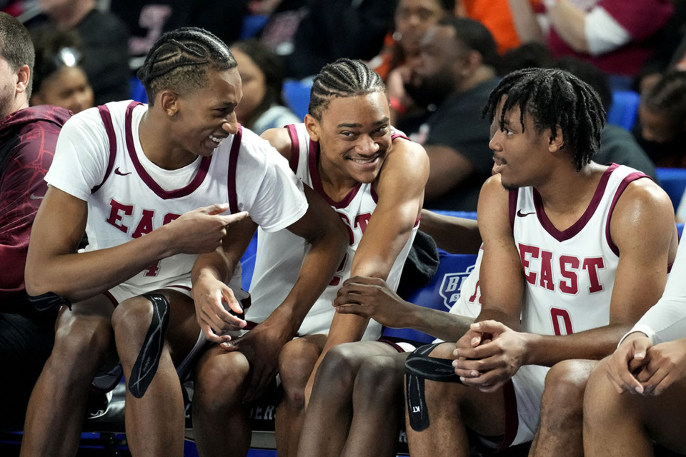 <strong>Memphis East's Alijah Curry, left; Barack Beard, center; and Zackery Hayslett (0), right; celebrate in the final moments of their win over Dobyns-Bennett on Wednesday, March 15, 2023, in Murfreesboro, Tenn.</strong> (Mark Humphrey/Special to The Daily Memphian)