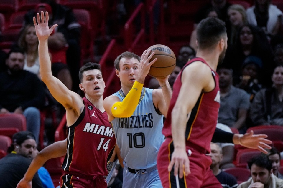 <strong>Memphis Grizzlies guard Luke Kennard (10) looks to pass the ball while defended by Miami Heat guard Tyler Herro (14) on March 15, 2023, in Miami.</strong> (Rebecca Blackwell/AP)