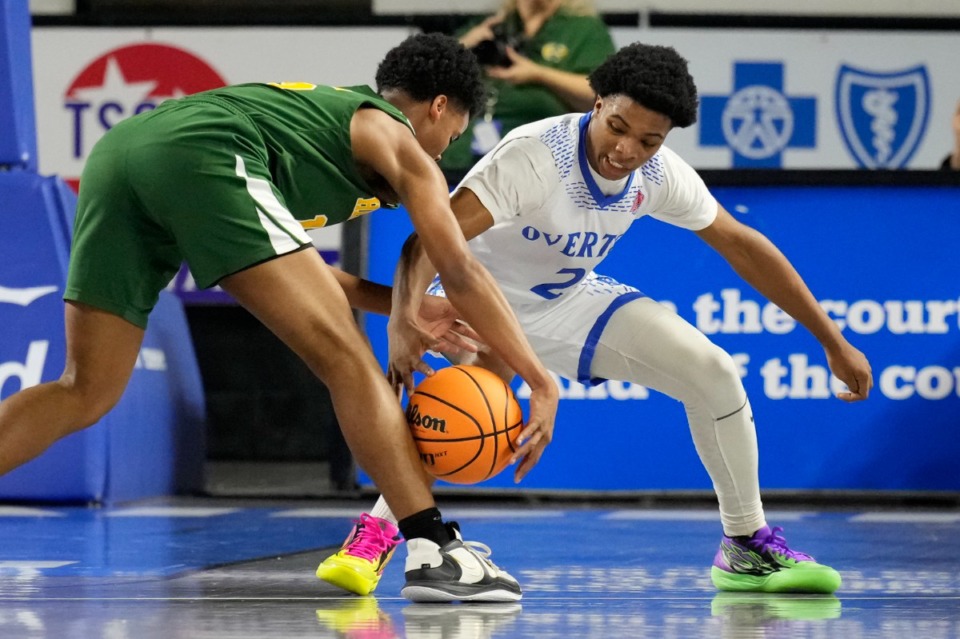 <strong>Hillsboro's Arnez Anderson, left, and Overton's Xavier Alexander (2) battle for the ball during the first half of a Class 4A game in the TSSAA boys&rsquo; state basketball tournament Friday, March 17, 2023, in Murfreesboro, Tenn.</strong> (Mark Humphrey/Special to The Daily Memphian)