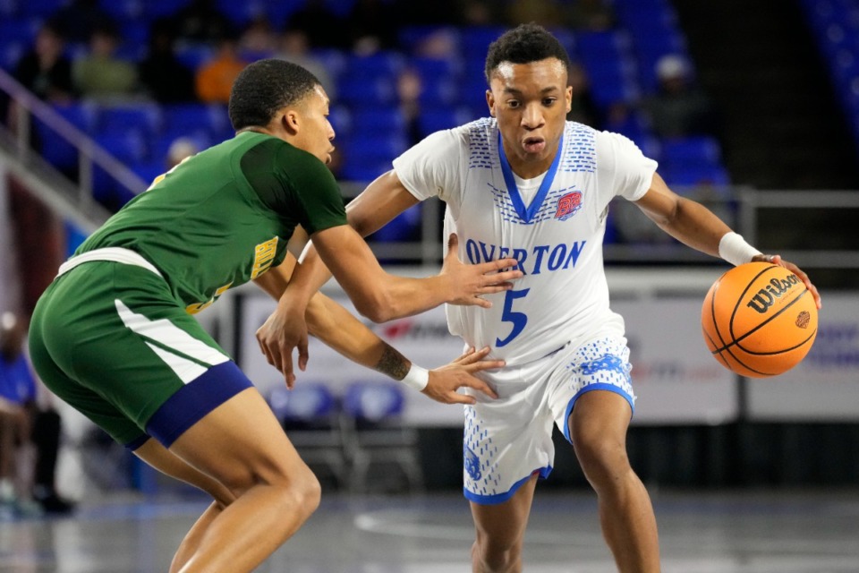 <strong>Overton's Jordan Frison (5) drives against Hillsboro's Thaddeus Johnson, left, during the first half of a Class 4A game in the TSSAA boys&rsquo; state basketball tournament Friday, March 17, 2023, in Murfreesboro, Tenn.</strong> (Mark Humphrey/Special to The Daily Memphian)