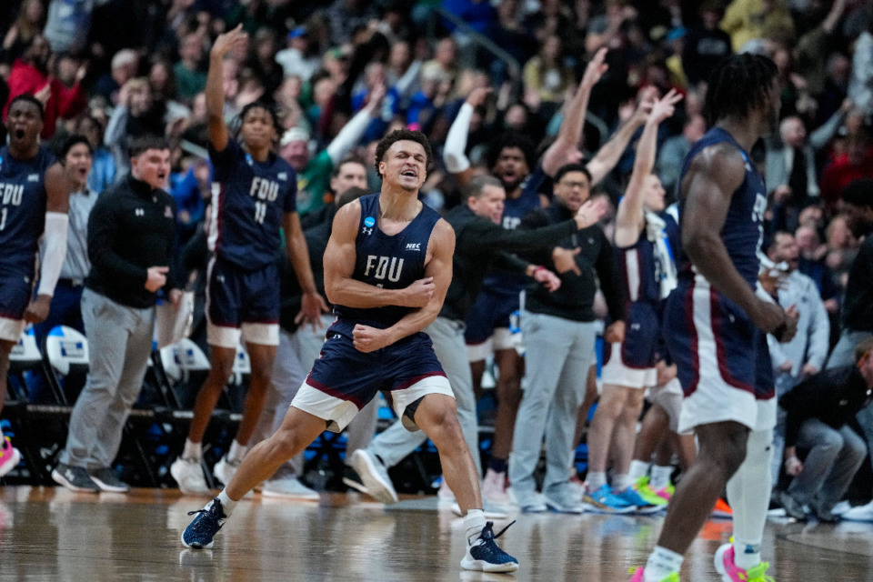 <strong>Fairleigh Dickinson guard Grant Singleton (4) celebrates after a basket against Purdue in the second half of a first-round college basketball game in the men's NCAA Tournament in Columbus, Ohio, Friday, March 17, 2023.</strong> (AP Photo/Michael Conroy)