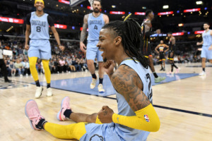 <strong>Memphis Grizzlies guard Ja Morant, foreground, reacts in the second half of an NBA basketball game against the Phoenix Suns Jan. 16 in Memphis.</strong> (Brandon Dill/AP Photo file)