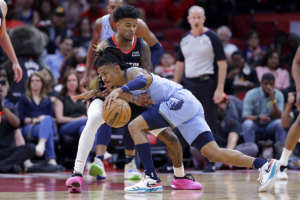 <strong>Memphis Grizzlies guard Ja Morant, front, drives around Houston Rockets guard Jalen Green, back, during the first half of an NBA basketball game March 1 in Houston.</strong> (Michael Wyke/AP Photo)