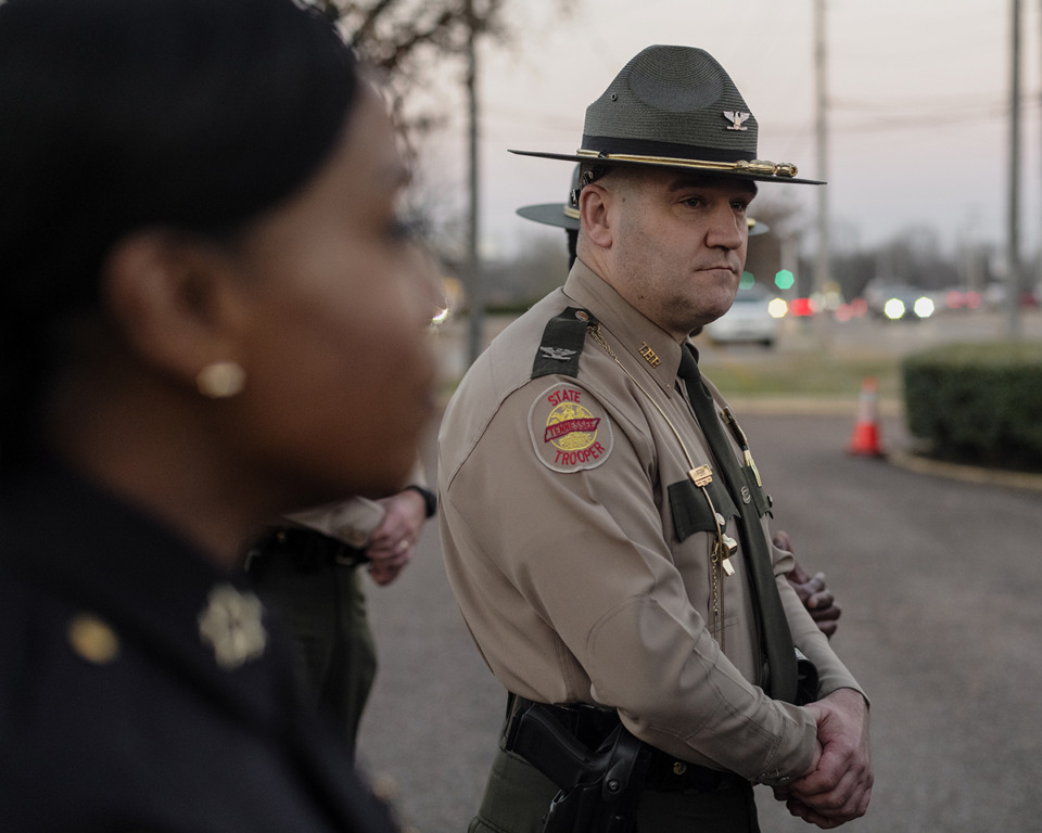 <strong>State troopers, the Memphis Police Department and media surround Tennessee Gov. Bill Lee as he described his plan to add 20 Tennessee Highway Patrol troopers to help police patrol the interstate.</strong> (Houston Cofield/Special to The Daily Memphian file)