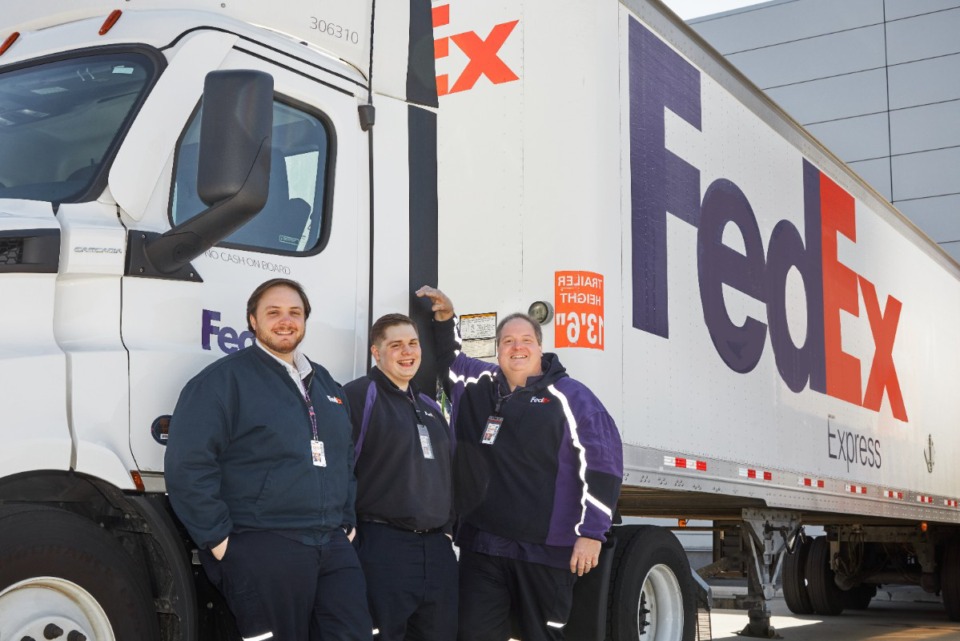 <strong>FedEx employs 35,000 here, more than twice as many as any other employer, public or private. Many famillies have two generations on the payroll at the shipping giant, including the Douglass family. From left are Roman Douglass, a second-shift aviation maintenance superiviser, Nolan Douglass and father John Douglass, who both drive trucks for FedEx Freight.</strong> (Submitted by FedEx)