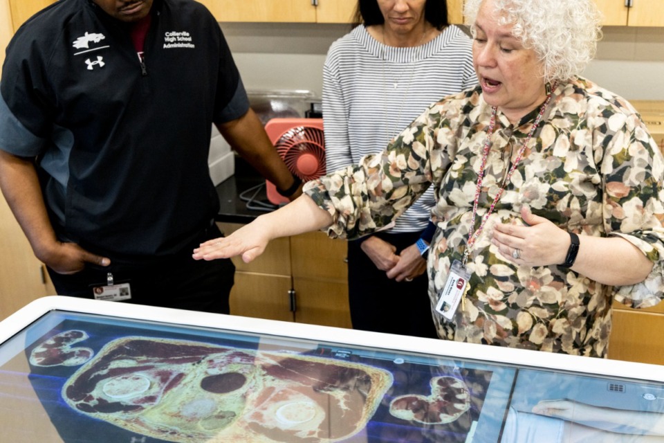 <strong>Collierville High instructor Beth Hines,shows off the school&rsquo;s new Anatomage on Friday, March 24, 2023. The 3D, virtual dissection platform enables students to visualize human anatomy like they would on a real cadaver.</strong> (Brad Vest/Special to The Daily Memphian)
